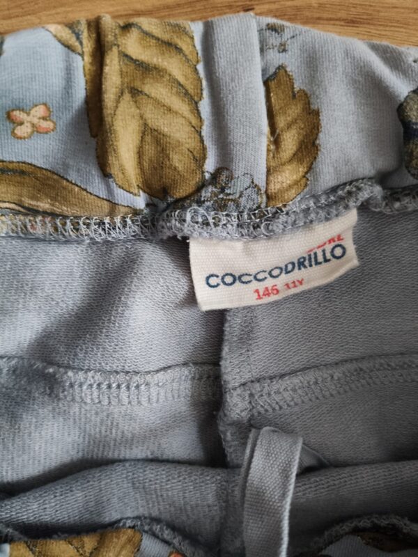 Coccodrillo - spodnie dresowe w kwiaty - 146 cm